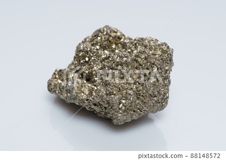 Raw crystalline pyrite iron pyrite, fool's gold . Mineral pyrite from the group of sulfides. The mineral pyrite on a white background Raw crystalline pyrite iron pyrite, fool's gold . Mineral pyrite from the group of sulfides. The mineral pyrite on a white background 88148572