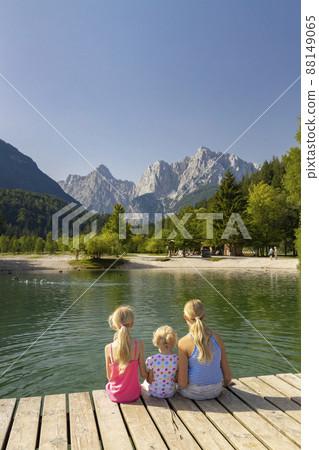 Children by the lake near village Kranjska Gora in Triglav national park, Slovenia 88149065