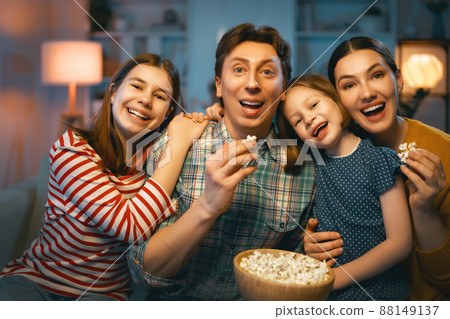 Mother, father and daughters spending time together. Mother, father and daughters spending time together. 88149137