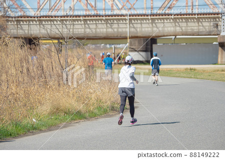 Marathon event: A woman running desperately Marathon event: A woman running desperately 88149222