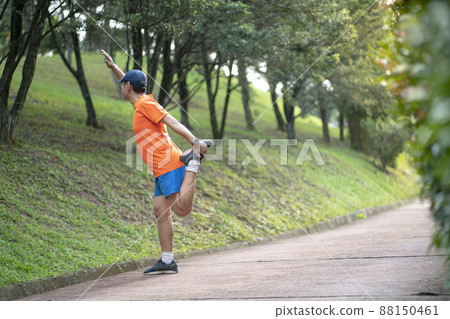 Man athlete doing workout at the park. Man athlete doing workout at the park. 88150461