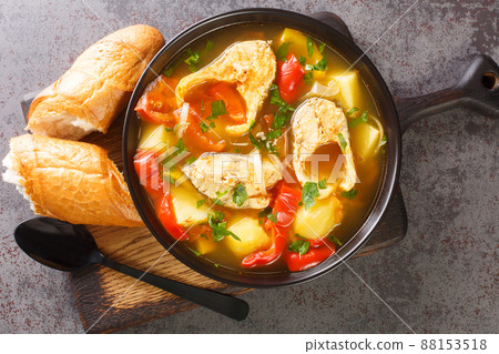 Portuguese Traditional Fishermans Stew Caldeirada De Peixe close-up in a bowl on the board. Horizontal top view Portuguese Traditional Fishermans Stew Caldeirada De Peixe close-up in a bowl on the board. Horizontal top view 88153518