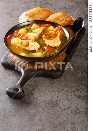 Portuguese fish stew Caldeirada de Peixe close-up in a bowl. Vertical 88153528