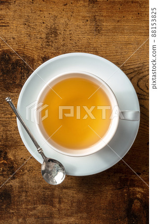 Tea in a white porcelain cup, shot from the top Tea in a white porcelain cup, shot from the top 88153825