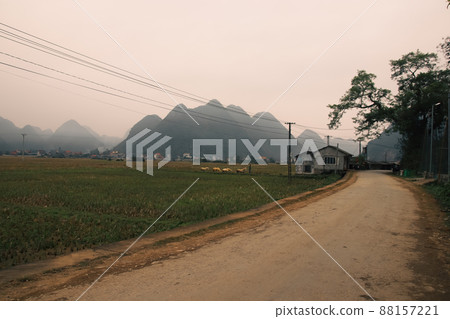 Cinematic scenery of fogs covering the karst mountains in rural Bac Son in Vietnam Cinematic scenery of fogs covering the karst mountains in rural Bac Son in Vietnam 88157221