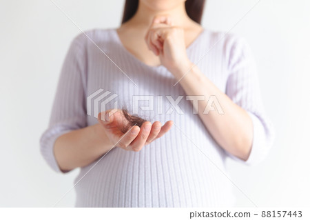 Pregnant women suffering from hair loss 88157443