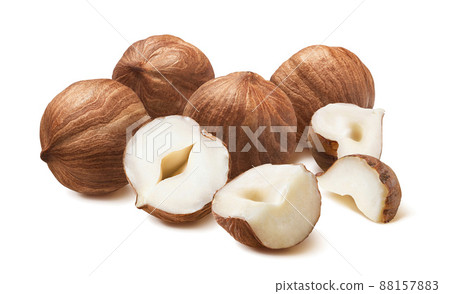 Pile of shelled hazelnuts isolated on white background 88157883