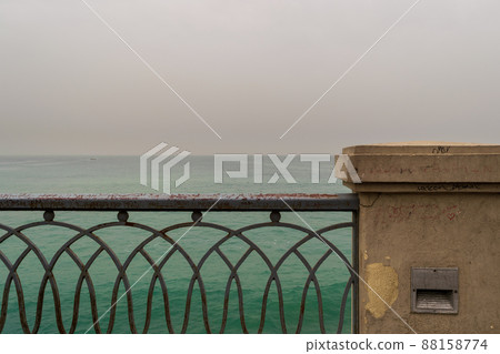 Rusted metal decorated protective fence of Stanley bridge at Alexandria with Mediterranean Sea in the background Rusted metal decorated protective fence of Stanley bridge at Alexandria with Mediterranean Sea in the background 88158774