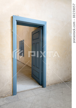 Blue wooden vintage door with yellow plaster wall Blue wooden vintage door with yellow plaster wall 88159057