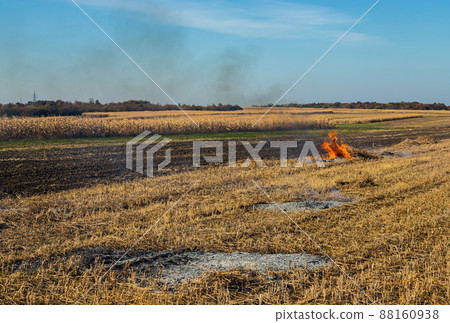 incineration of agricultural waste - smog and pollution. Harmful emissions from burning hay and straw in agricultural fields incineration of agricultural waste - smog and pollution. Harmful emissions from burning hay and straw in agricultural fields 88160938