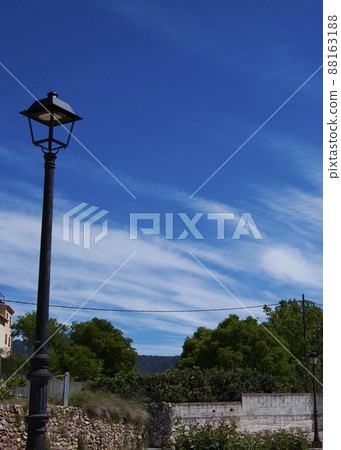 Rustic lamppost in the middle of the field 88163188