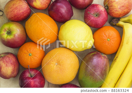 Background of fresh fruits; Oranges, apples, mango, bananes, mandarines Background of fresh fruits; Oranges, apples, mango, bananes, mandarines 88163324