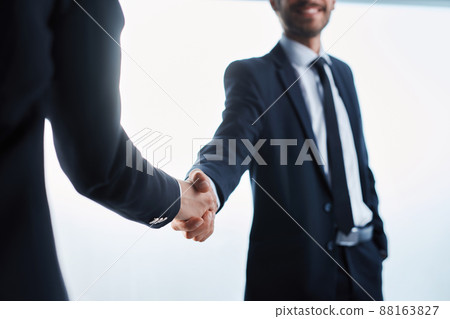 young businessman shaking hands with his business partner. 88163827