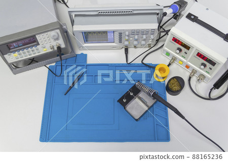 Power supplies and electronic measuring devices in the laboratory. Top view. Power supplies and electronic measuring devices in the laboratory. Top view. 88165236