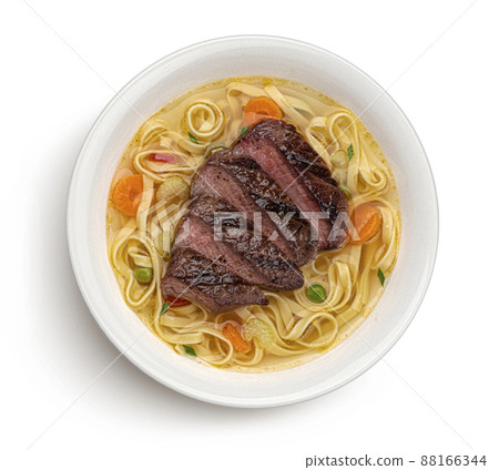 Fettuccine noodles with grilled beef isolated on white, top view 88166344