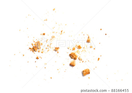 Scattered crumbs of vanilla chip butter cookies isolated on white background. Close-up view of brown crackers. Macro shot of yellow biscuit cake leftovers for your design Scattered crumbs of vanilla chip butter cookies isolated on white background. Close-up view of brown crackers. Macro shot of yellow biscuit cake leftovers for your design 88166455