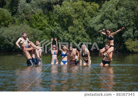 Group of young people fun on the beach, river water 88167343