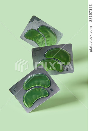 Eco eye patches on green backgound. Face care beauty treatment concept 88167558
