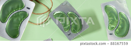 Eco eye patches on green backgound. Face care beauty treatment concept 88167559