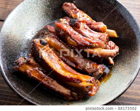 Pork spareribs on a black plate Pork spareribs on a black plate 88173502