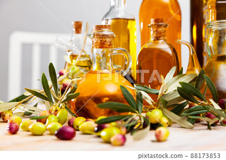 Olive oil in bottles on wooden table Olive oil in bottles on wooden table 88173853