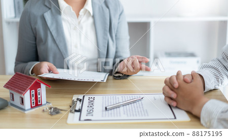Insurance concept the broker explaining the agreement of the contract to his customer Insurance concept the broker explaining the agreement of the contract to his customer 88175195