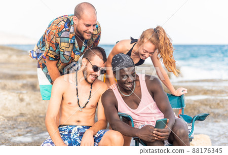 Group of young people on the beach taking a selfie. Group of young people on the beach taking a selfie. 88176345