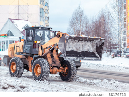 Cleaning and cleaning of roads in the city from snow in winter Cleaning and cleaning of roads in the city from snow in winter 88176713
