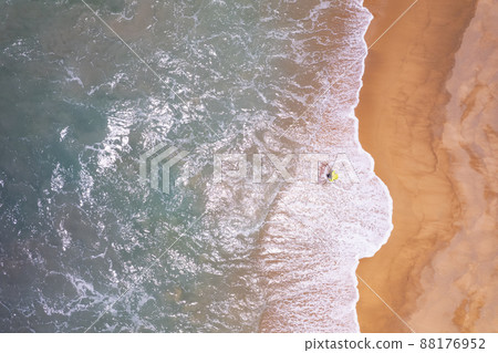 Aerial view top down of Local southern Thai fisherman uses his handmade fish trap and cicada sea on a beach in Phuket Thailand.Beautiful waves crashing on beach Aerial view top down of Local southern Thai fisherman uses his handmade fish trap and cicada sea on a beach in Phuket Thailand.Beautiful waves crashing on beach 88176952