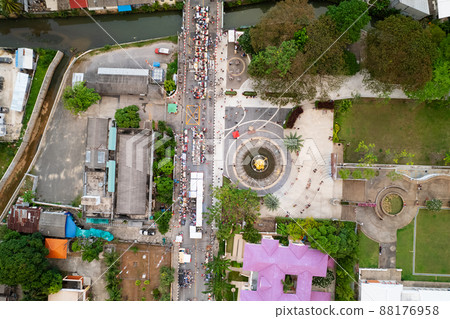 Aerial view Drone flying over phuket city Thailand.Drone over a street night market in Sunday at Phuket Town and Tourists walking shopping at old street full of local vendors selling Food and Clothes 88176958