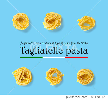 Italian pasta tagliatelle. raw pasta fettuccine pop art background, flat lay. Italian raw nest pasta isolated on blue Italian pasta tagliatelle. raw pasta fettuccine pop art background, flat lay. Italian raw nest pasta isolated on blue 88178164