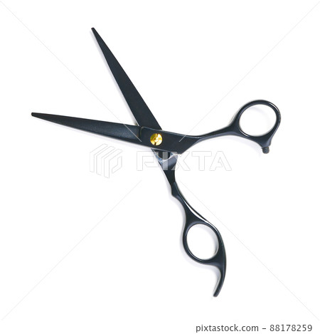 professional hairdresser black scissors isolated on white. Black barber scissors, close up. 88178259