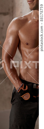 Shirtless handsome confident man in gloves for training 88178759