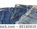 stack of blue jeans isolated	 88180816
