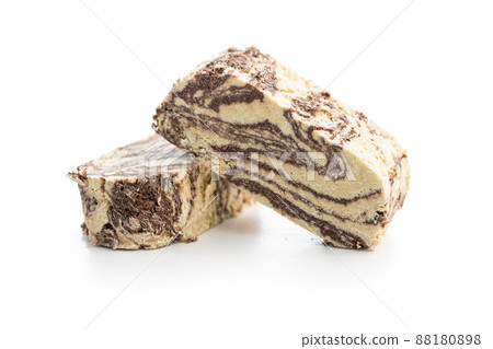 Sweet tahini halva with cocoa flavor . Turkish dessert isolated on white background. 88180898