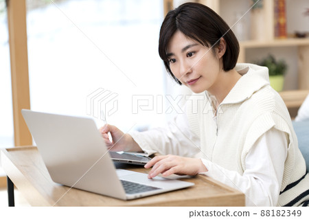 Young female designer teleworking 88182349