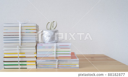 Image of collecting unnecessary books | Tie books with strings Image of collecting unnecessary books | Tie books with strings 88182877