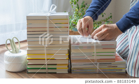 Image of collecting unnecessary books | Tie books with strings Image of collecting unnecessary books | Tie books with strings 88183149