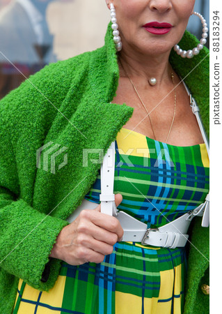 Stylish woman in warm wool green coat. Style, Street fashion trend look 88183294