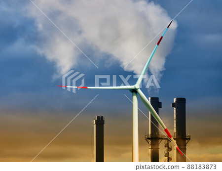 Cloud of steam and smoke from an incinerator chimney in front of a yellow and blue sky Cloud of steam and smoke from an incinerator chimney in front of a yellow and blue sky 88183873