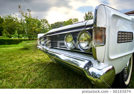 Close up wide angle view from front corner of historic antique classic white road cruiser from America 88183874