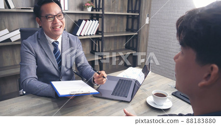 Businessman job interview by human resource HR officer interviwing, talk new employee shaking hands in office with smiling face. HR Manager interview check resume, face to face. Job Interview Concept 88183880