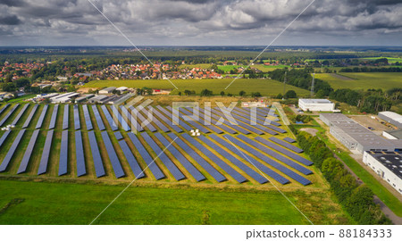 Aerial view of a large solar plant with solar panels on the edge of a village in Germany Aerial view of a large solar plant with solar panels on the edge of a village in Germany 88184333