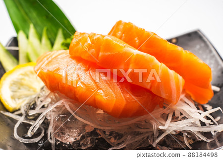 Sashimi, Salmon, Japanese food chopsticks and wasabi on the table 88184498