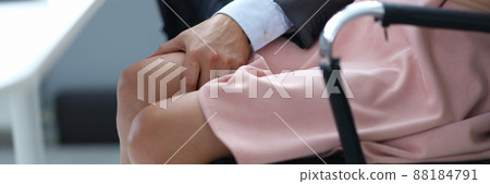 Businessman will put his hand on woman leg under table closeup Businessman will put his hand on woman leg under table closeup 88184791