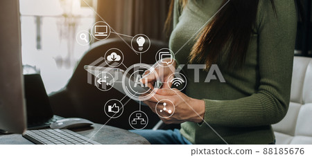 Women are using a tablet wifi connection on the desk in the morning. Women are using a tablet wifi connection on the desk in the morning. 88185676