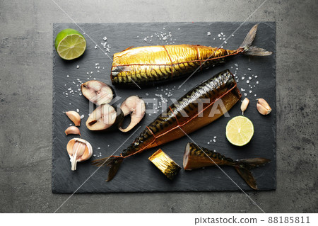 Tasty smoked fish on grey table, top view 88185811