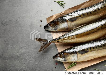 Tasty smoked mackerel fish on grey table 88185812