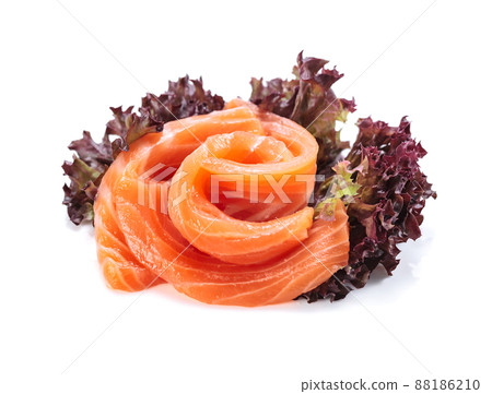 Salmon slices with salad isolated on white. Salmon slices with salad isolated on white. 88186210