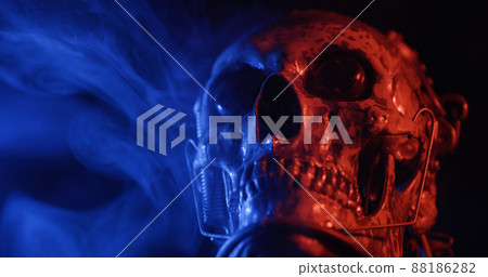 Robotic skull with blue and red lights and smoke Robotic skull with blue and red lights and smoke 88186282